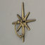 Rustic celestial cast iron starburst front door knocker in antique gold with mounting holes — 5" L x 1.25" W x 6.25" H