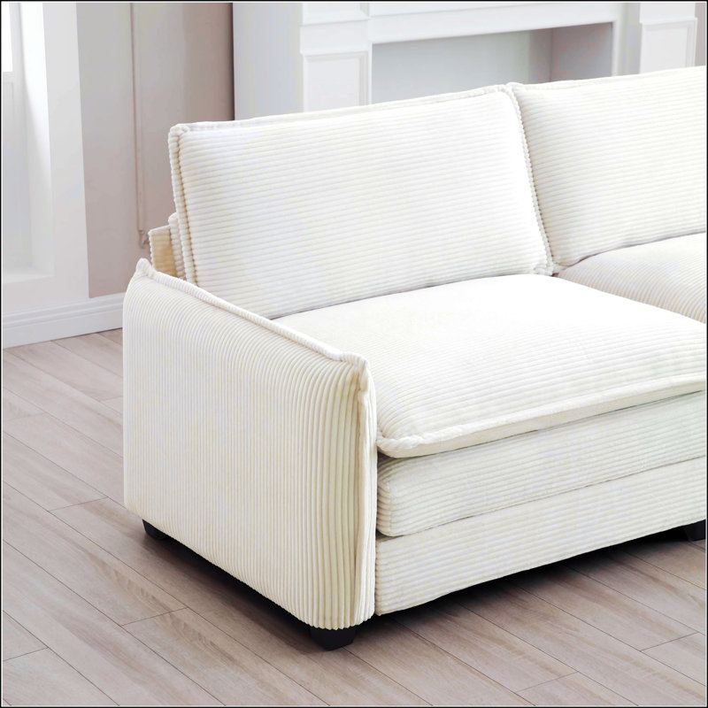 Canapé simple à siège profond avec repose-pieds et un coussin