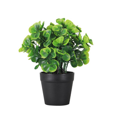 Plante artificielle verte en pot
