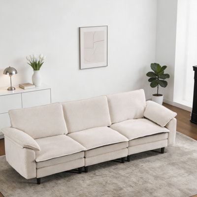 Ce canapé nuage blanc en forme de L de taille moyenne présente une conception modulaire et est livré avec un repose-pieds. Il a des coussins de siège et de dossier en chenille épais, pour les salons, les chambres et les appartements.