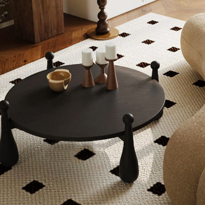 French-style solid wood black coffee table.