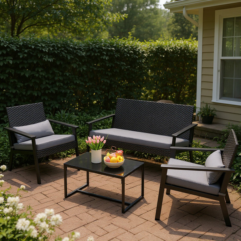 Ensemble de patio 4 pièces en osier 4 personnes - Causeuse, chaise et table basse avec coussins