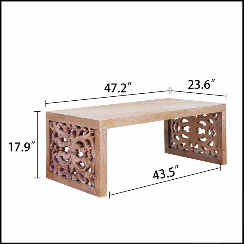 Table basse rustique en bois sculpté avec panneaux latéraux ornés, idéale pour les intérieurs traditionnels et bohèmes.