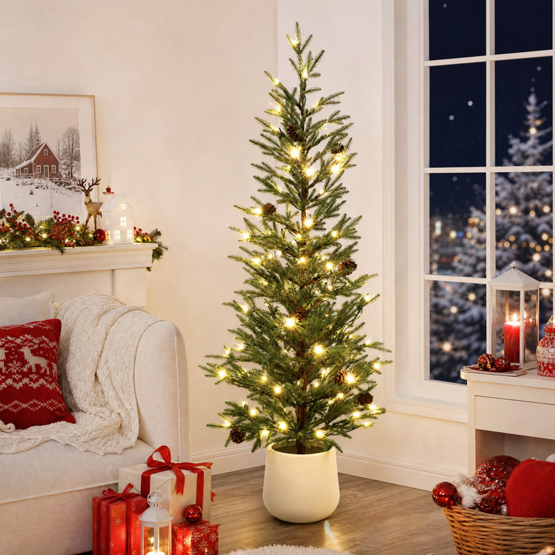 Sapin de Noël artificiel vert de 1,5 m (5 pi) aux branches clairsemées, avec des pommes de pin dans un pot blanc
