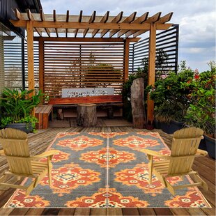 https://assets.wfcdn.com/im/52327696/resize-h310-w310%5Ecompr-r85/1924/192493847/amandus-orangeblue-outdoor-plastic-straw-rug.jpg