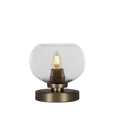 Lampe d'appoint Whitmire présentée en finition laiton New Age avec verre à bulles transparent de 7 po