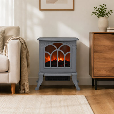 Ce foyer électrique de style rétro présente un effet de flamme simulé, créant une atmosphère chaleureuse et élégante.