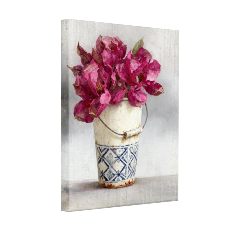Plantes et fleurs Fleurs roses dans un seau bleu et blanc