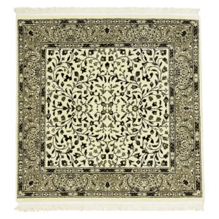Tapis floral crème en laine noué à la main