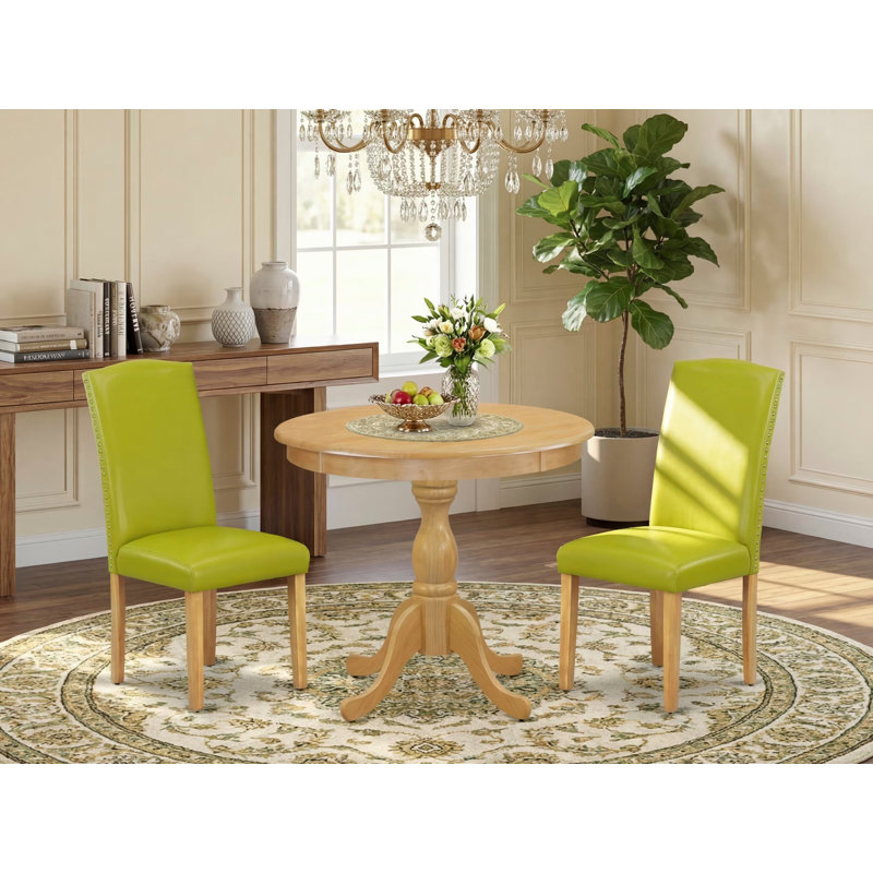 3 Piece Wooden Dining Table Set Contains 1 Round Pedestal Table and 2 Autumn Green PU faux Leather Parsons Chair High Back with Nail Heads - Oak Finish