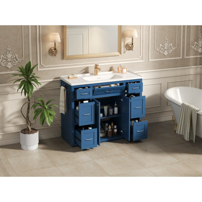 Meuble-lavabo bleu marine 48 po avec lavabo en céramique - 6 tiroirs (3 de chaque côté), tiroir central rabattable, portes doubles à fermeture en douceur, porte-serviettes latéral réversible, poignées argentées, panneau de fibres à densité moyenne