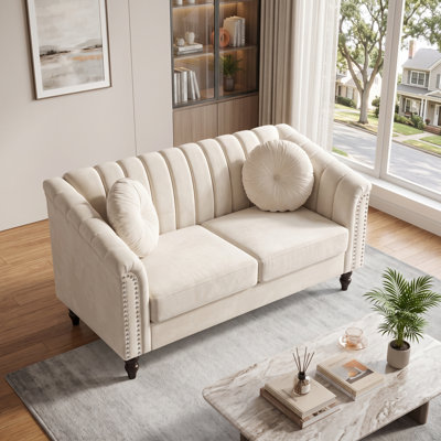 White Upholstered Loveseat with Channel Tufting, Rolled Arms and Nailhead Trim