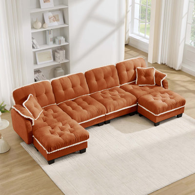 Canapé d'angle en chenille nuage avec pouf amovible et finitions à pompons