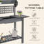 Table de rempotage d'extérieur, poste de travail en bois, tablette de rangement et évier à sec-414083468