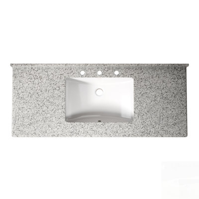 Plan de toilette en granit avec lavabo encastré en céramique blanche, doté d'une surface résistante aux taches et de trous prépercés pour la robinetterie, idéal pour une rénovation moderne.