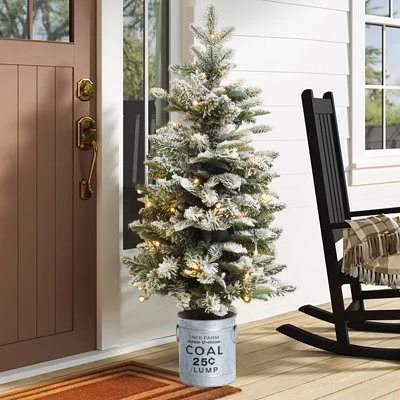 Snow-flocked Lighted Christmas Tree