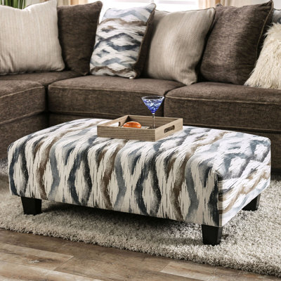 Repose-pieds rembourré de style contemporain avec pieds blocs fuselés en microfibre doux au fini contemporain