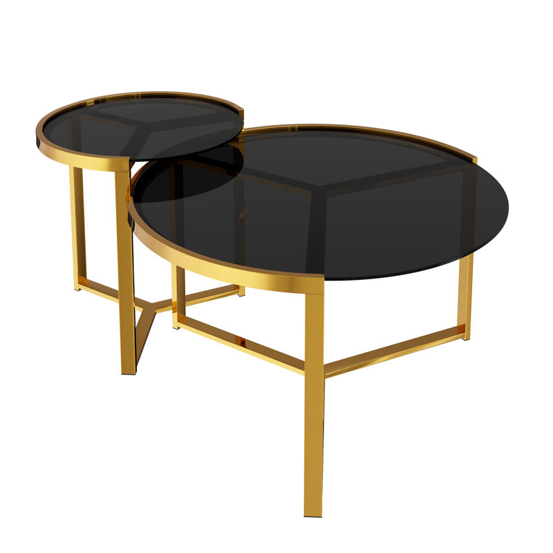 Ensemble de deux tables basses gigognes rondes au style glamour moderne, avec structure en métal doré et plateaux en verre noir.