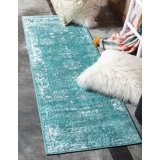 Pokorny Turquoise Area Rug