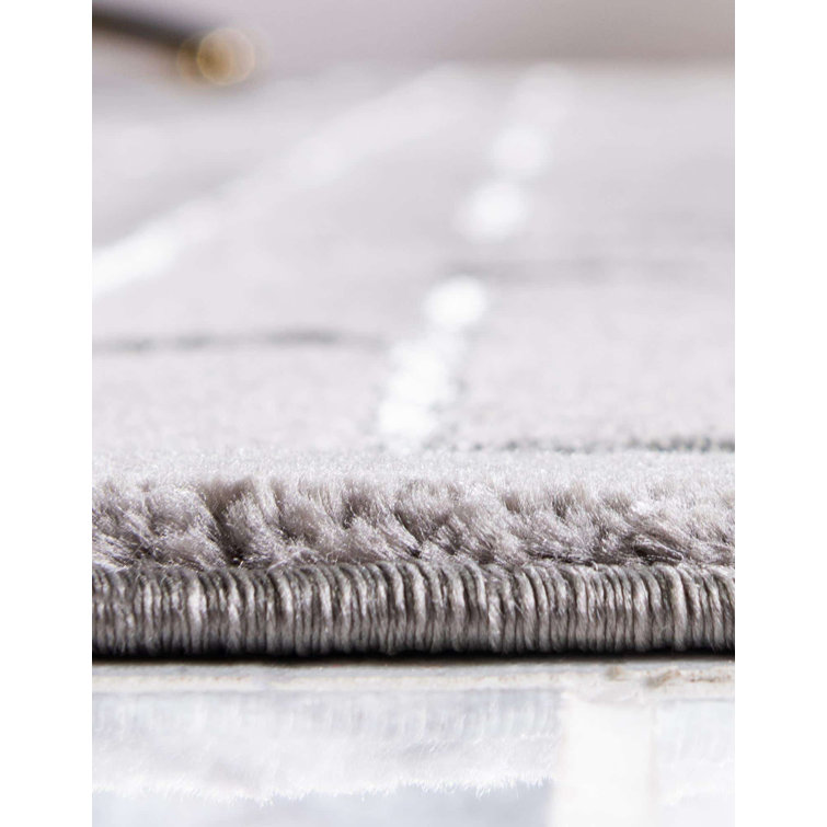 Tapis gris argenté à motif géométrique glam