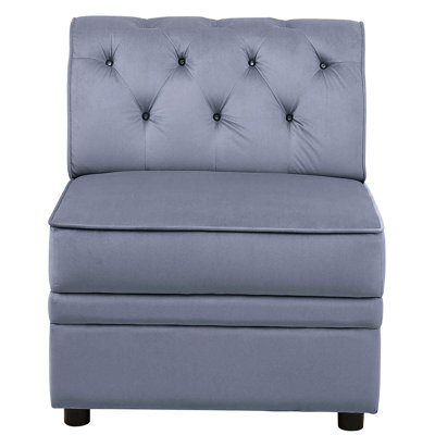 Fauteuil gris sans accoudoirs en velours avec capitonnage à boutons pour un salon élégant