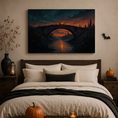 Citrouille lumineuse sur un pont de pierre au coucher du soleil - Toile murale d'Halloween