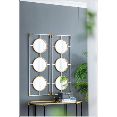 Élégant cadre doré et blanc avec miroirs convexes, parfait pour les intérieurs modernes et de style déco