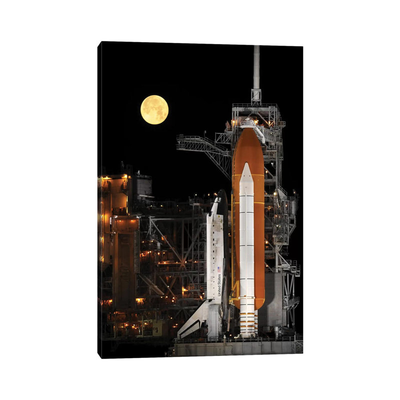 A Nearly Full Moon Sets As Space Shuttle Discovery Sits Atop The Launch Pad by Stocktrek Images - Wrapped Canvas Print