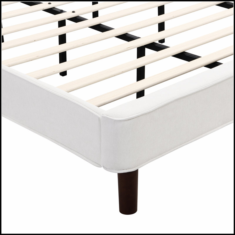 Lit plateforme tapissier avec tête de lit à oreilles, tissu doux et structure robuste pour un sommeil confortable et élégant