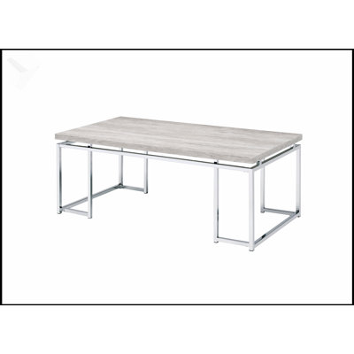 Table basse moderne et contemporaine en chêne naturel avec base en métal chromé, parfaite pour les salons élégants et les bureaux.