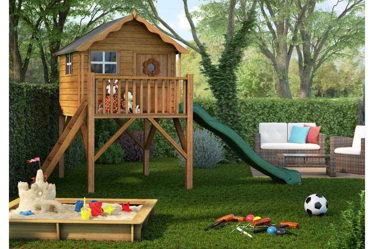image of a backyard with a swing set, sandpit, croquet set, and other outdoor games on a lawn