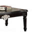 Table basse noire avec pieds tournés