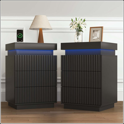 Set of 2 Black Nightstands with Charging Station, LED Lights, and Fluted Wave Panel – Sliding Top Hidden Storage