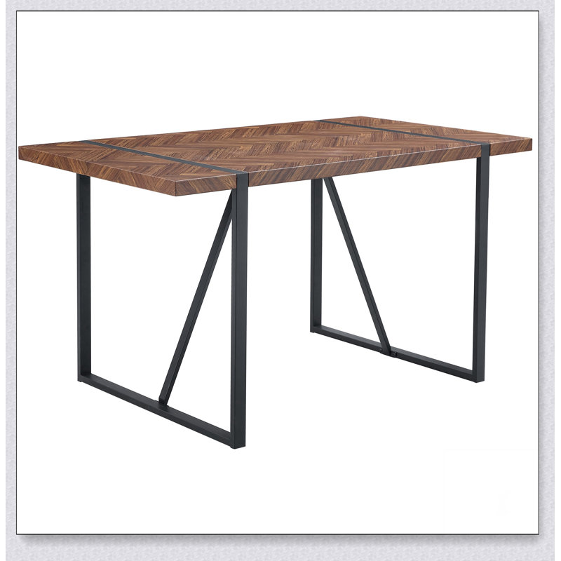 Une table de salle à manger rectangulaire rétro minimaliste avec un dessus spécialement texturé et des pieds en métal noir