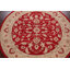 Tapis rond rouge / beige en laine touffeté à la main