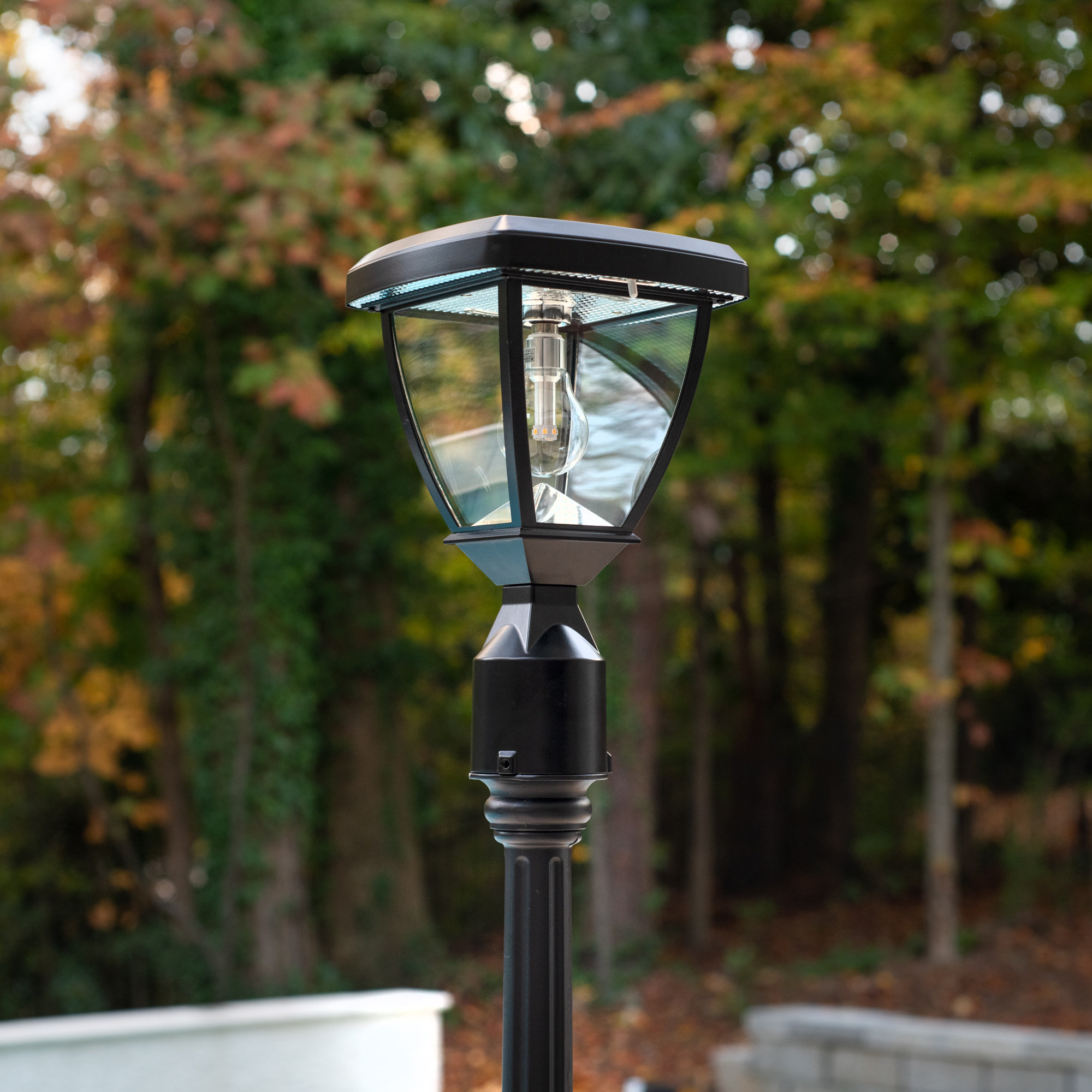 https://assets.wfcdn.com/im/52730329/compr-r85/2351/235166468/kyven-black-solar-powered-3-in-1-outdoor-light.jpg