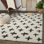 Tapis géométrique crème / noir Carris