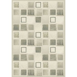 Makiver Cream Area Rug