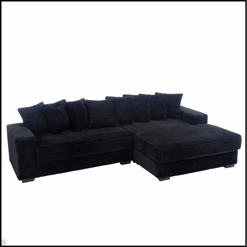 Canapé confortable surdimensionné en velours côtelé avec plusieurs coussins pour la détente et le style moderne