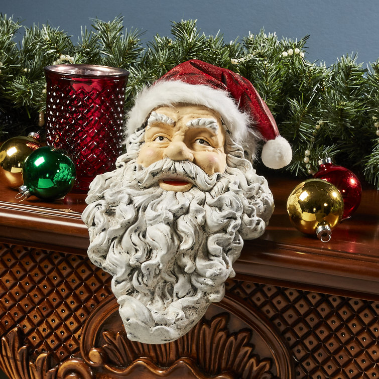 https://assets.wfcdn.com/im/52749630/resize-h755-w755%5Ecompr-r85/2314/231405860/Ho-Ho-Hold+It+Santa+Mantle+Stocking+Holder+Figurine.jpg