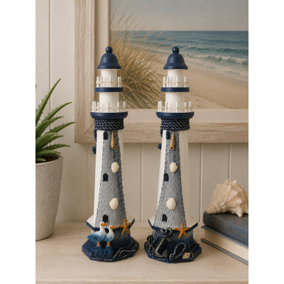 Set Of 2 Assorted Beach Items In Fishing Nets On Lighthouse Figurines