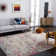 Felty Abstract Machine Made Power Loom Polypropylene Area Rug in Black/Gold