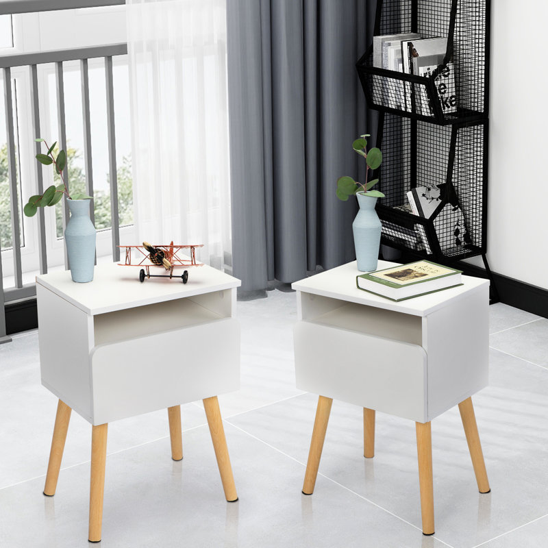 2 tables de chevet blanches avec tiroir et tablette pour un salon moderne