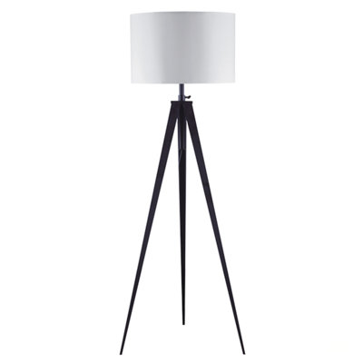 Lampe trépied à hauteur ajustable croisée avec métal noir mat et abat-jour en tissu blanc, parfaite pour les intérieurs modernes