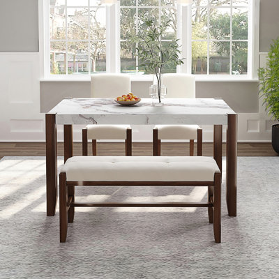 Ensemble de mobilier de salle à manger moderne 4 pièces avec table en faux marbre et conception compacte, parfait pour les repas de famille et une utilisation polyvalente.