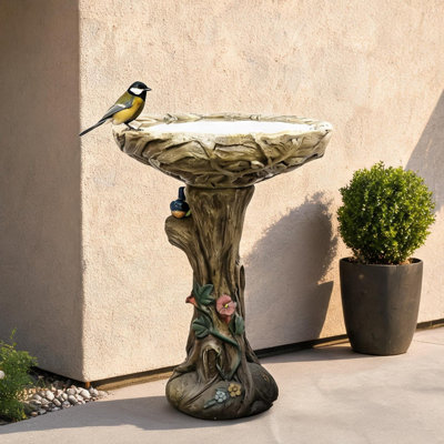 Rustic brown finish concrete bird bath with wood-look texture and decorative faux bird, 17.7-inch diameter bowl stands 25.5 inches tall