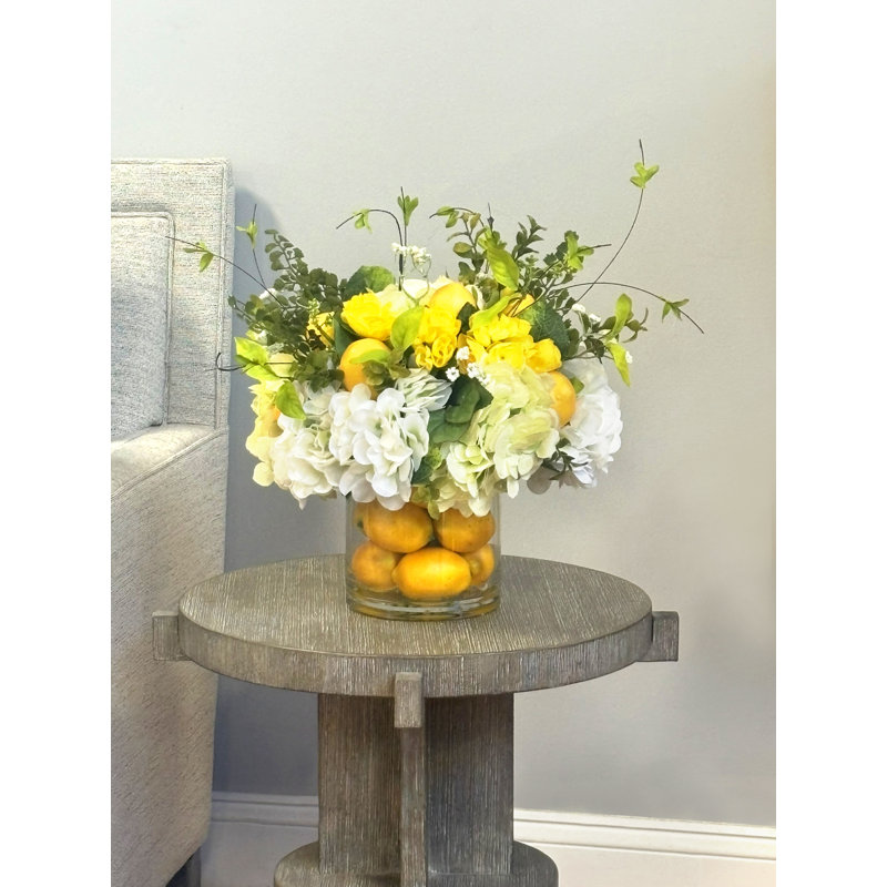 Hydrangea Florals, Kalanchoe, Berries And Lemons In A Clear Glass Vase With Realistic Looking Acrylic Water