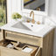 Meuble-lavabo avec portes en rotin et lavabo en résine
