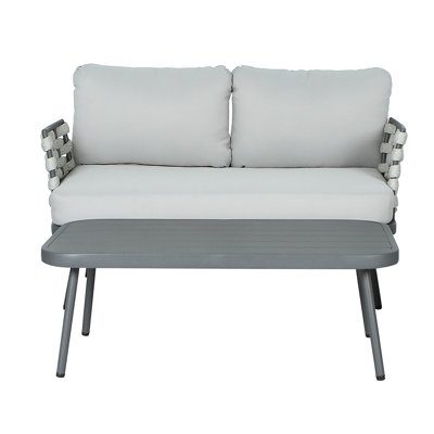 Causeuse en acier avec accoudoirs en corde tissée et table basse