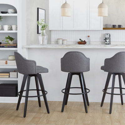 Tabouret de bar à hauteur fixe avec pivot en bois noir et tissu avec repose-pieds rond en métal noir - ensemble de 2
